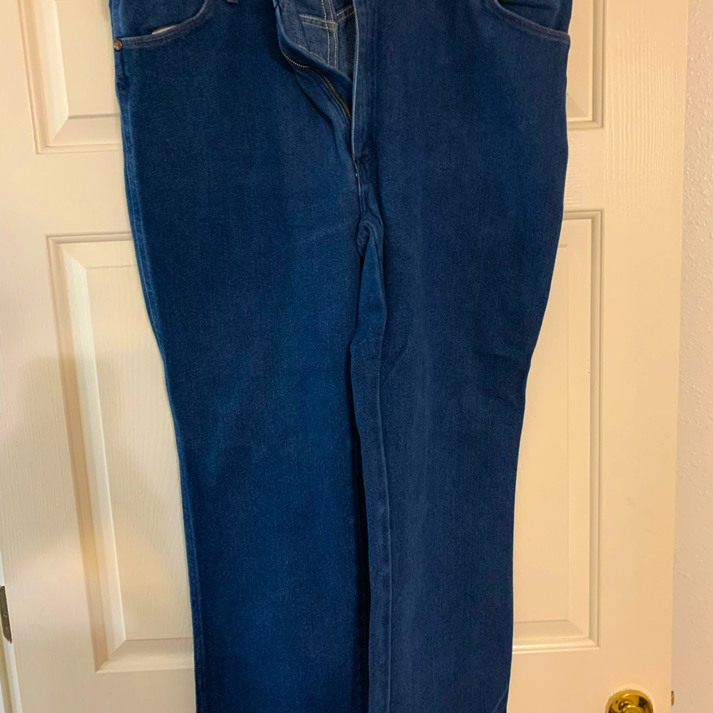 Wrangler 46x32 dark blue cotton poly blend.